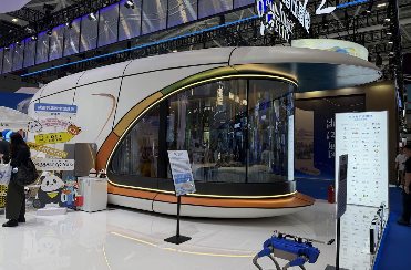 Space capsule cabin displayed at an indoor exhibition booth
