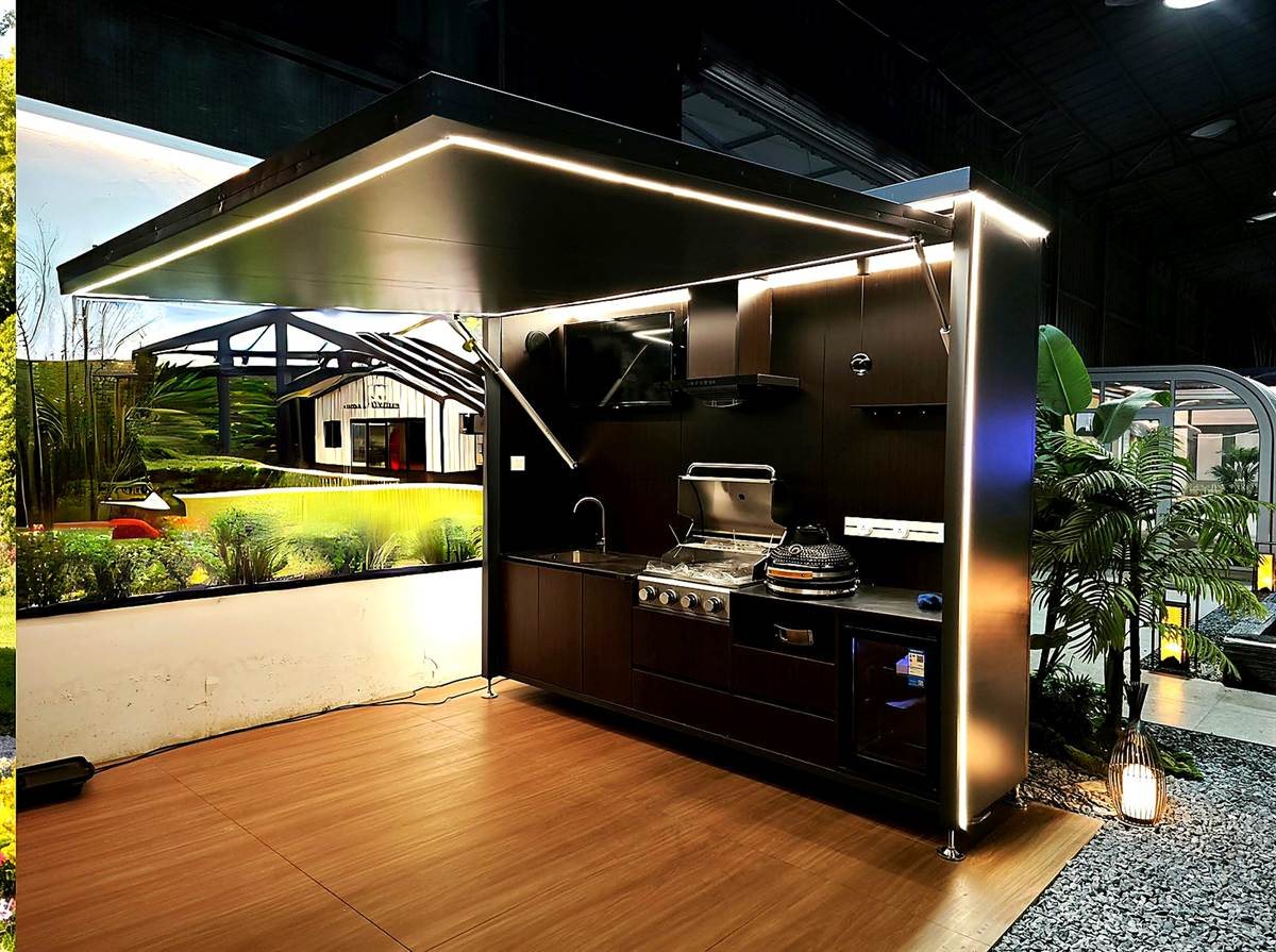 Black outdoor kitchen display module with LED lighting, grill, sink, and round ceramic cooker